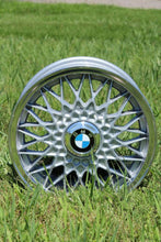 Load image into Gallery viewer, BMW basketweave wheel displayed outdoors, featuring Billet Hex Cap Conversion Kit upgrade for enhanced style and security.