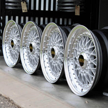 Load image into Gallery viewer, Set of four 15-inch BBS RS001 wheels with polished lips and silver powder-coated faces, perfect for classic cars, PCD: 4x100.