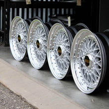 Load image into Gallery viewer, 15-inch BBS RS001 wheels with high polished lips, powder coated metallic silver faces, and black barrels, perfect for classic cars.