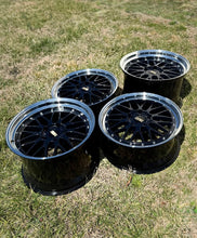 Load image into Gallery viewer, 19" BBS LM287 and LM415 wheels for Porsche 997 widebody, black and blue finish, black bright diamond cut rim, set of four on grass.