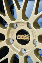 Load image into Gallery viewer, Close-up of gold BBS LM472 wheel for Porsche 991, showing polished lip and 2-piece die-forged aluminum construction.
