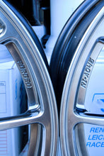 Load image into Gallery viewer, Close-up of BBS RI-A wheels with 5x120 bolt pattern in diamond black finish, highlighting forged construction and detailed engraving.