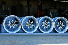 Load image into Gallery viewer, Set of four 20-inch BBS LM-R wheels with diamond black centers and diamond-cut rims for G8X M fitment, on display in a garage.