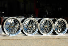 Load image into Gallery viewer, Black and blue 19" BBS LM wheels for Porsche 997 widebody fitment with diamond cut rims displayed in a row.