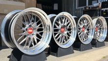 Load image into Gallery viewer, 19-inch BBS LM227/228 wheels with brushed finish and 5x120 bolt pattern displayed on stands.