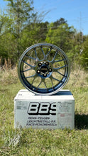 Load image into Gallery viewer, 18-inch BBS RG-R wheel in diamond black finish displayed on a box outdoors