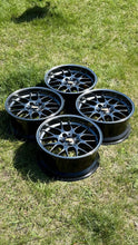 Load image into Gallery viewer, Set of four diamond black BBS RG-R wheels on grass, 18-inch, designed for BMW E30 M3, E36, and other models, lightweight forged aluminum.