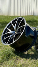 Load image into Gallery viewer, 18-inch BBS RI-A wheel in diamond black finish on grass, featuring concave lightweight design suitable for E46 and E9X M3 fitments.