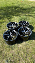 Load image into Gallery viewer, Set of four 18-inch BBS RI-A wheels in diamond black finish, ideal for E46 and E9X M3, showing concave design on grass.