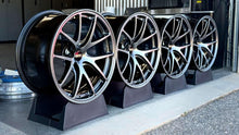 Load image into Gallery viewer, Set of four 18" BBS RI-A wheels in diamond black, concave design, perfect for E46 M3 and E9X M3 fitments, displayed in a garage.