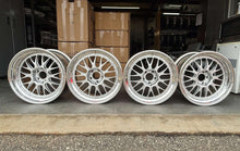 Load image into Gallery viewer, Set of four 18-inch BBS E88 race wheels with silver faces, perfect for E46 M3s and E9X M models, displayed in warehouse.