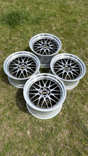 Load image into Gallery viewer, Set of four 19-inch BBS LM wheels, F8X M fitment, diamond black with silver diamond cut rim, 5x120 PCD, on grass background.