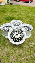 Load image into Gallery viewer, 19-inch BBS LM272 wheels in diamond silver on grass, showcasing classic mesh design and high-performance fitment for E46 M3 and E9X models.
