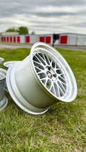 Load image into Gallery viewer, 19-inch BBS LM272 wheel with classic mesh design in diamond silver finish, perfect for E46 M3 and E9X M, resting on grass.
