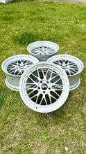 Load image into Gallery viewer, 19-inch BBS LM272 281 wheels in diamond silver, classic mesh design, suitable for E46 M3 and E9X M fitment, set of four on grass.
