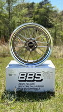 Load image into Gallery viewer, BBS LM471/474 two-piece forged wheel displayed on box outdoors, suitable for Porsche 992 with 5x130 bolt pattern, enhancing performance.
