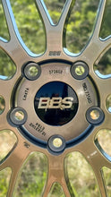 Load image into Gallery viewer, Close-up of BBS LM471 wheel showing logo and bolt pattern, designed for high-performance vehicles with a 5x130 pattern.
