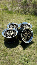 Load image into Gallery viewer, Set of four BBS LM471 / 474 wheels, two-piece forged, 5x130 bolt pattern, ideal for Porsche 992, shown on grass background.
