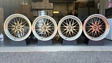 Load image into Gallery viewer, Four BBS LM471 / 474 wheels for Porsche 992, showcasing 20&quot; front and 21&quot; rear rims with 5x130 bolt pattern in a garage setting.
