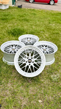 Load image into Gallery viewer, Set of 19-inch BBS LM272 5x120 alloy wheels in diamond silver finish, arranged on grass, ideal for E46 M3 and E9X M models.

