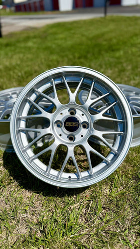 16 inch BBS RG-F forged aluminum wheel in brilliant silver, featuring black and gold logo, perfect for E30 BMW, 4x100 PCD.