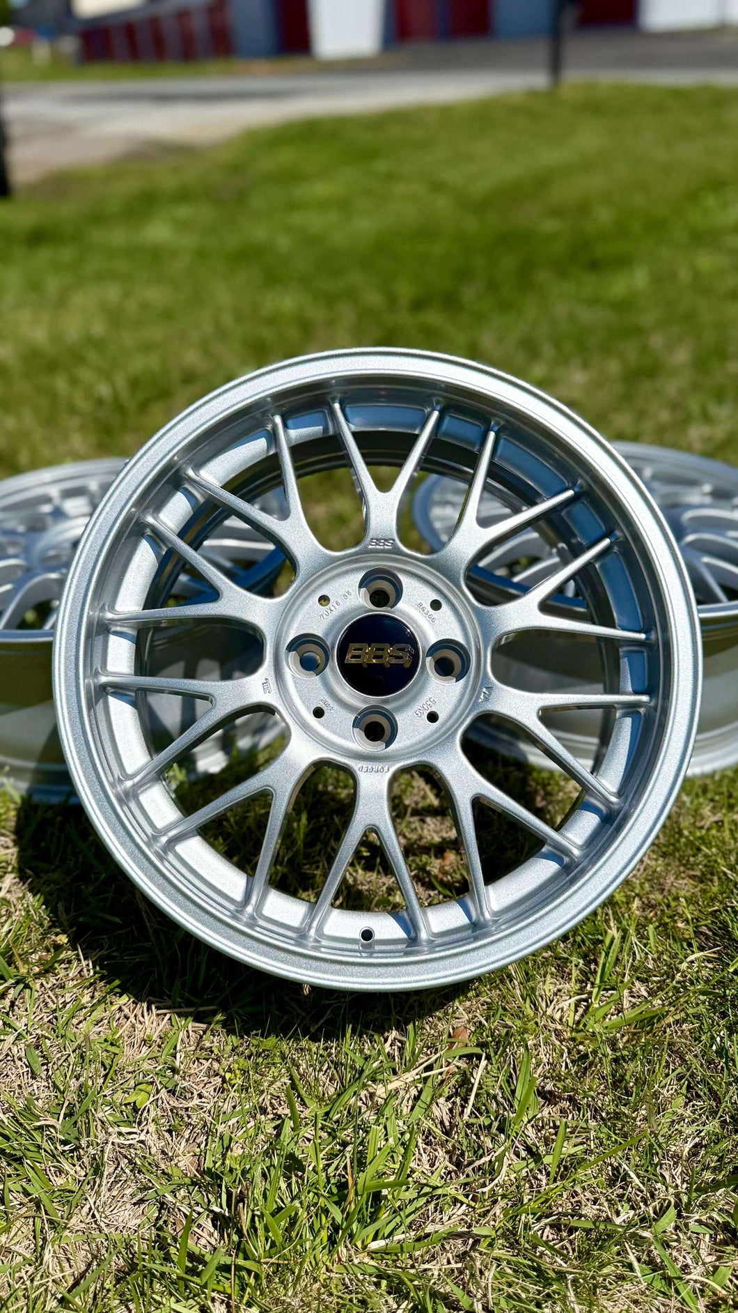 16 inch BBS RG-F forged aluminum wheel in brilliant silver, featuring black and gold logo, perfect for E30 BMW, 4x100 PCD.