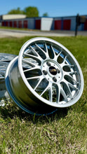 Load image into Gallery viewer, 16-inch BBS RG-F RG366 wheel in brilliant silver finish, showcasing intricate design, ideal for E30 BMW, on grass
