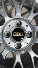 Load image into Gallery viewer, Close-up of a 16-inch BBS RG-F forged aluminum wheel, brilliant silver finish, with black and gold logo, PCD 4x100 fitment for BMW E30.
