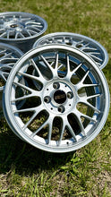 Load image into Gallery viewer, 16-inch BBS RG-F aluminum wheel in brilliant silver finish with 4x100 PCD, ideal for E30 BMWs, shown on grass background.

